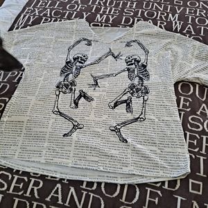 Bizarre dancing skeletons/newspaper shirt